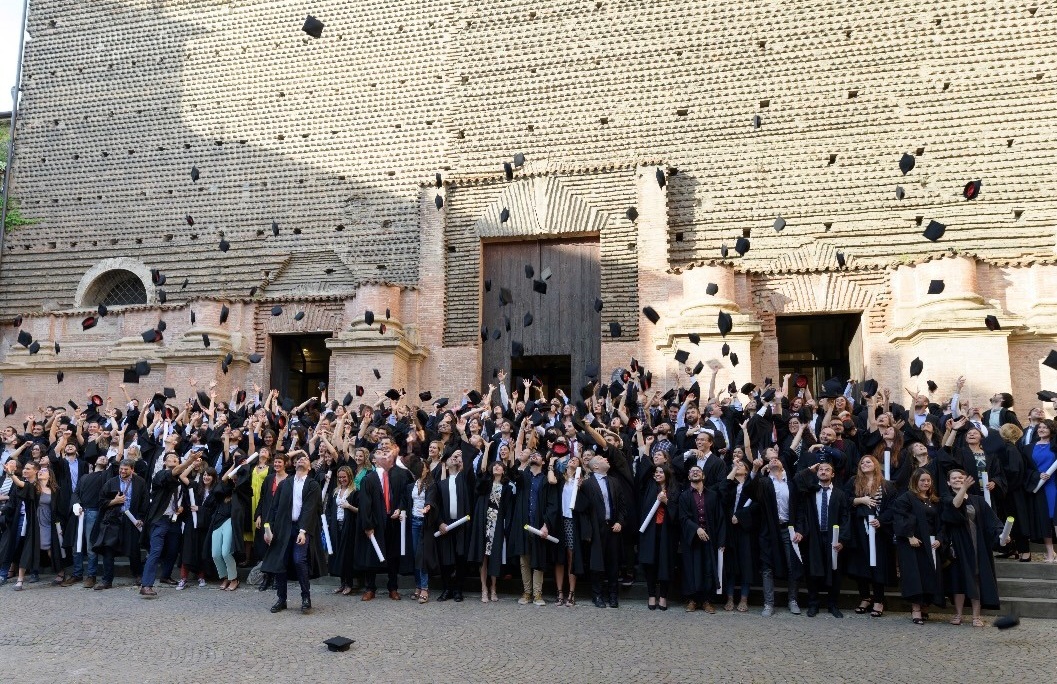 The graduation cap toss in front of Santa Lucia
